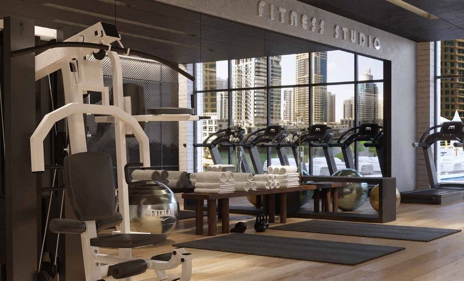 Luxurious gym overlooking the pool
